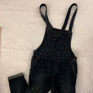 Free People dark denim overalls with suspender style straps and open back